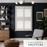 Living room window with white shutters and dark blue walls